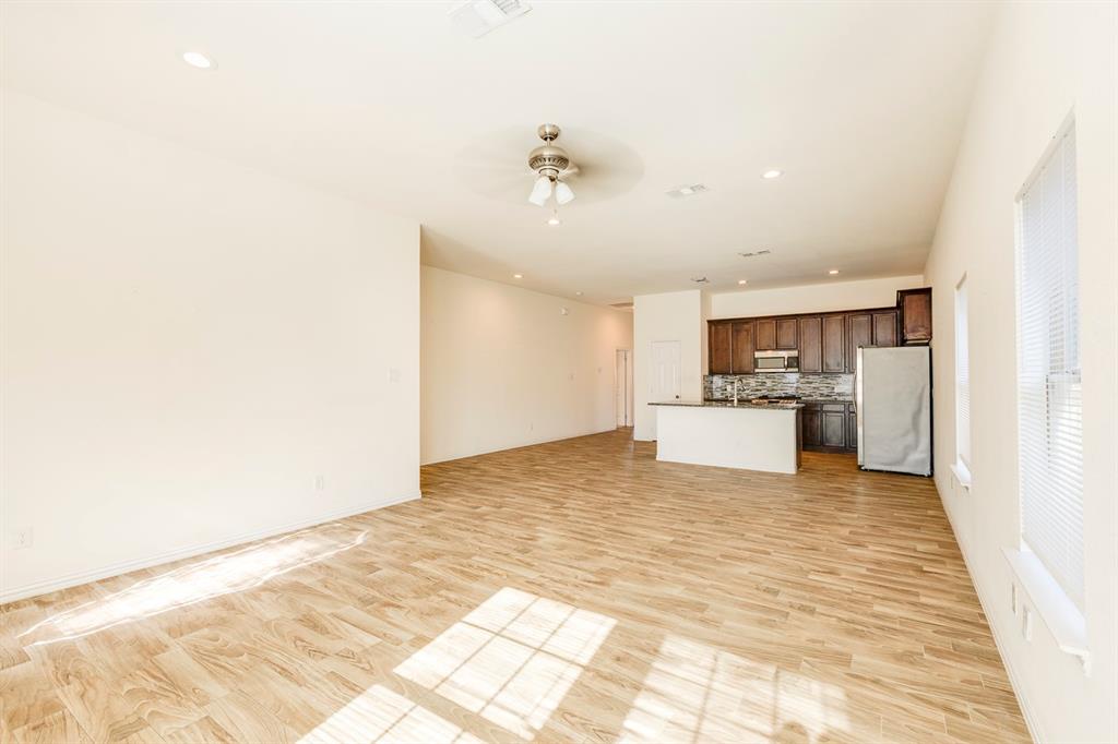 14247 Greenhaw Lane Dallas, TX 75253 - Photo 27 of 39 a view of kitchen with wooden floor