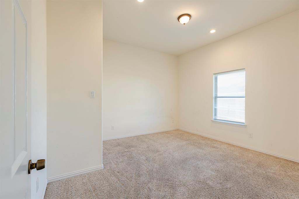 14247 Greenhaw Lane Dallas, TX 75253 - Photo 35 of 39 an empty room with windows