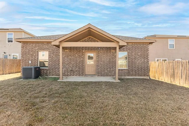 a view of empty room with windows
