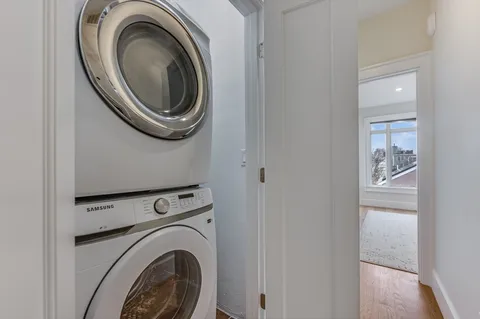 a view of storage and utility room with washer and dryer