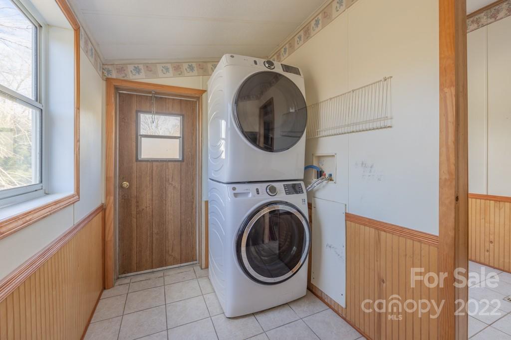 890 Hyder Mountain Road Clyde, NC 28721 - Photo 3 of 24 a view of a hallway with washer and dryer