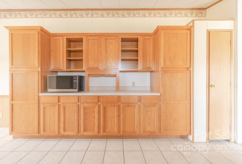 890 Hyder Mountain Road Clyde, NC 28721 - Photo 8 of 24 a view of a refrigerator and window