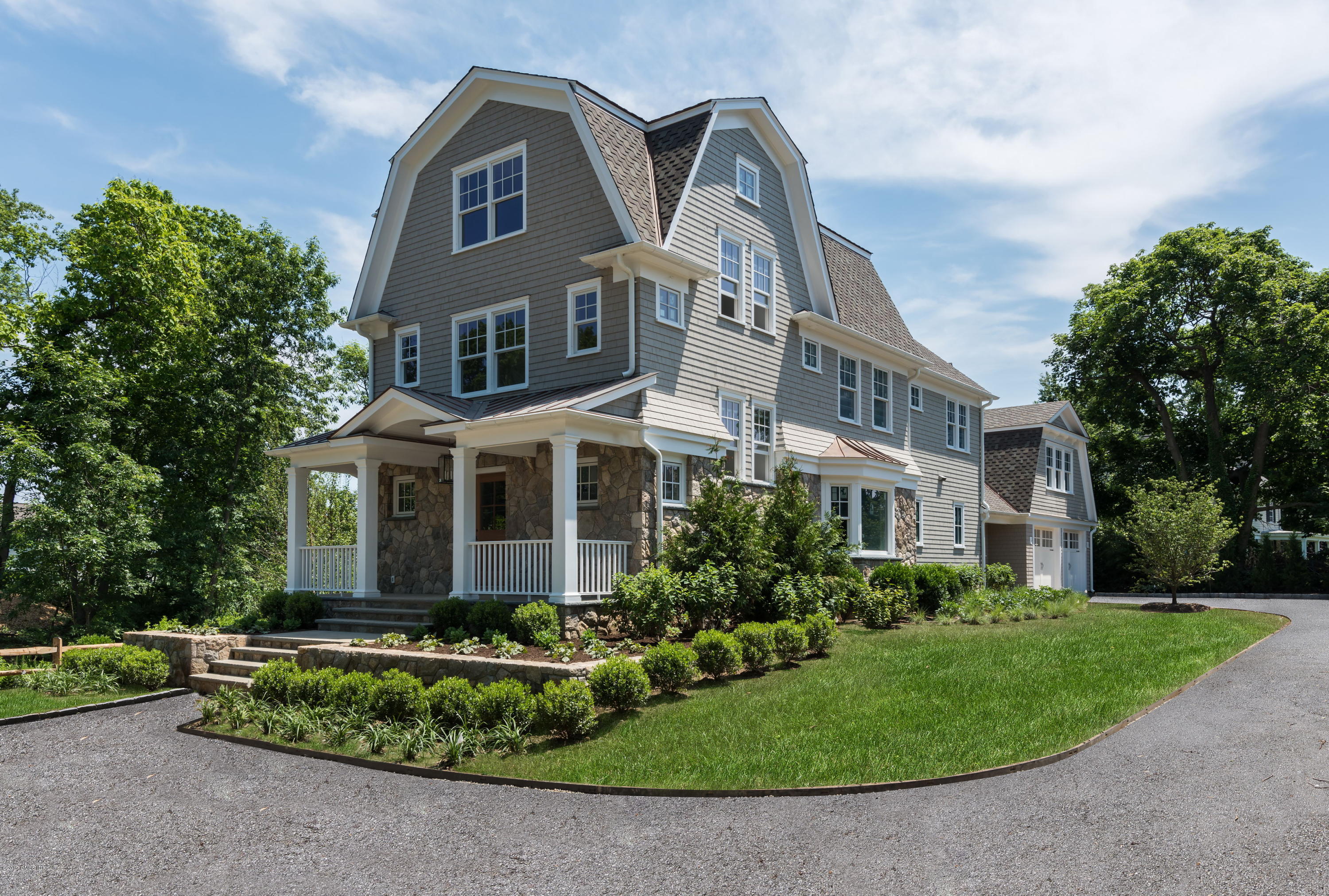 front view of a house with a garden