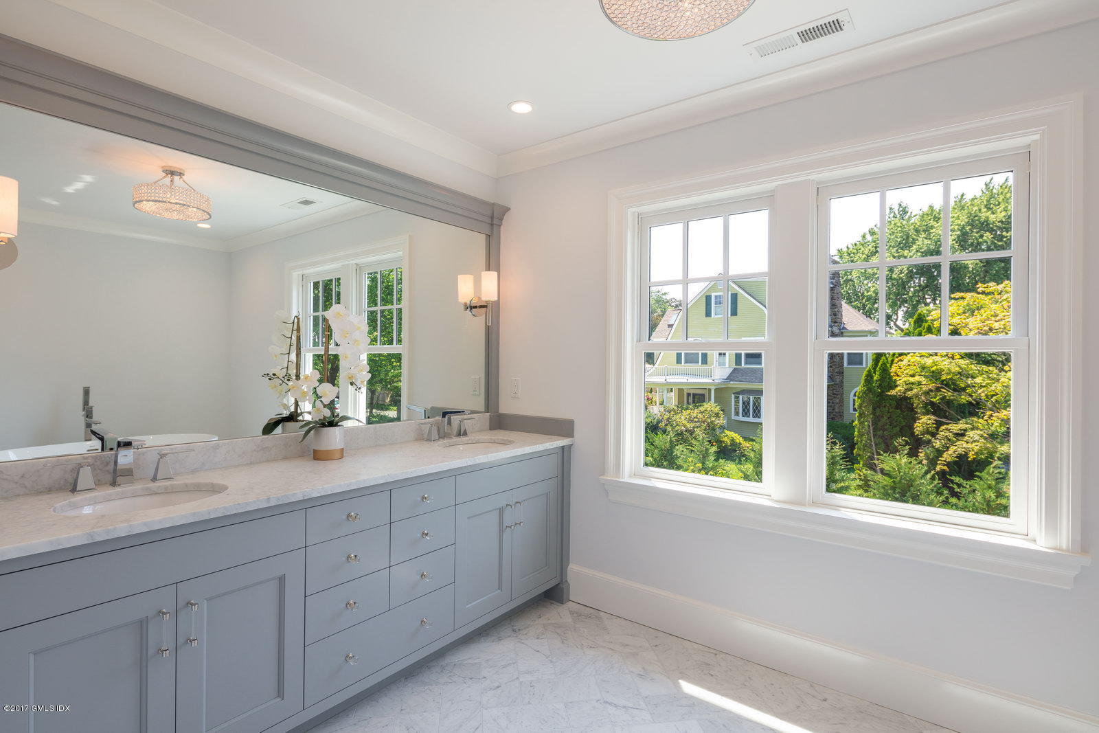 12 Ballwood Road Old Greenwich, CT 06870 - Photo 12 of 25 a bathroom with a double vanity sink and large window
