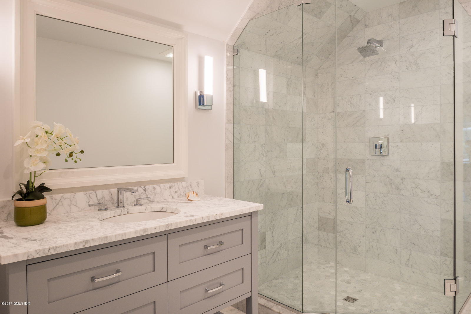 12 Ballwood Road Old Greenwich, CT 06870 - Photo 15 of 25 a bathroom with double sink and a mirror
