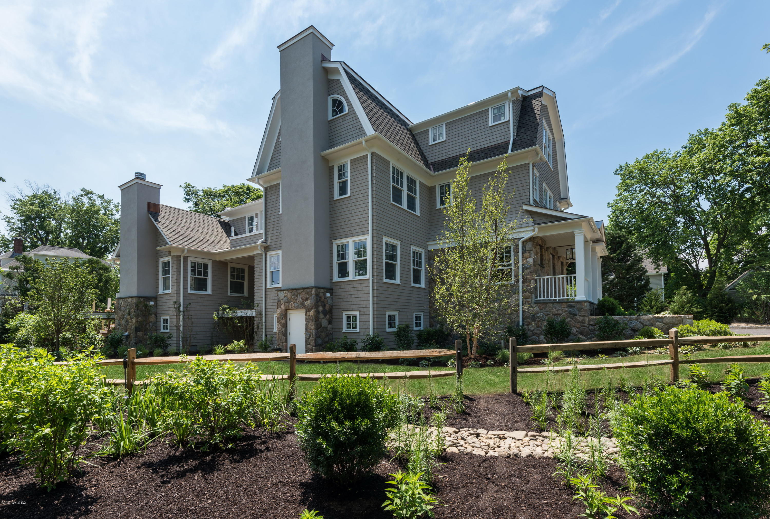 12 Ballwood Road Old Greenwich, CT 06870 - Photo 18 of 25 a front view of a house with a yard