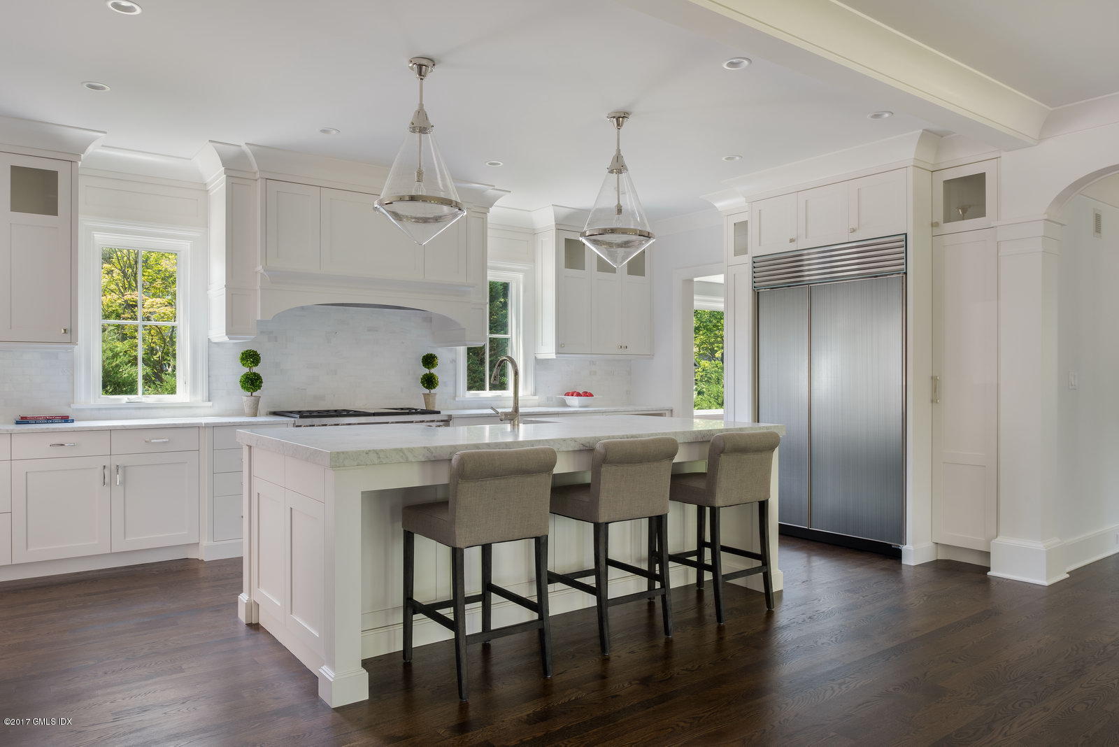 12 Ballwood Road Old Greenwich, CT 06870 - Photo 6 of 25 a kitchen with stainless steel appliances granite countertop a sink a stove a refrigerator and island with wooden floor