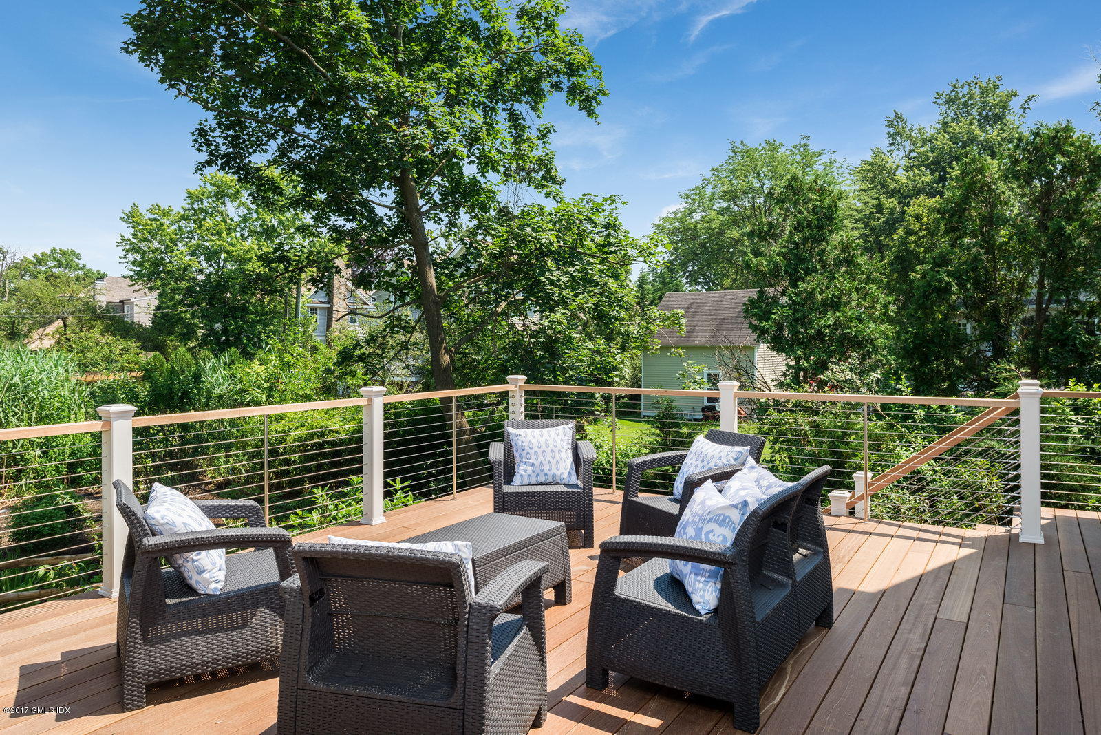 12 Ballwood Road Old Greenwich, CT 06870 - Photo 10 of 25 a view of a deck with couches wooden floor and fence