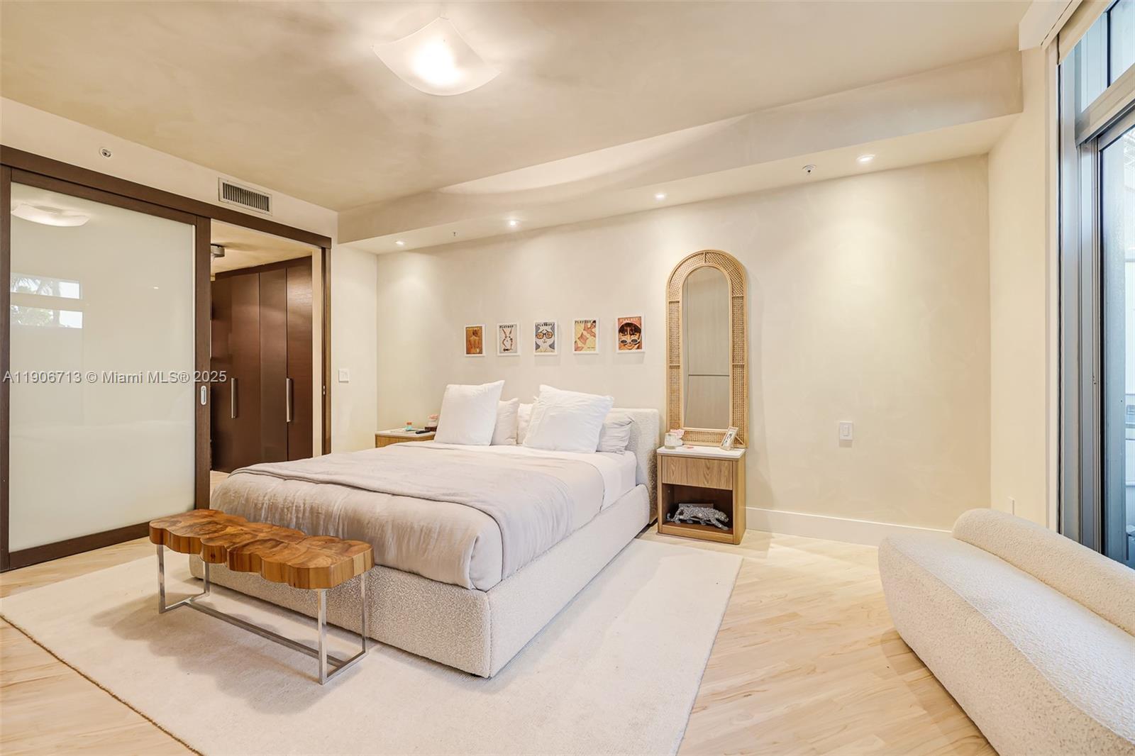 2001 Meridian Avenue, Unit 307 Miami Beach, FL 33139 - Photo 15 of 25 a spacious bedroom with a bed and a window