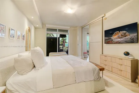 a large white bed in a white room