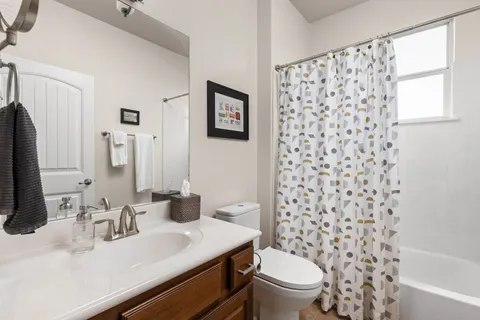 a view of a livingroom with furniture and a window