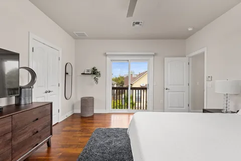 a spacious bathroom with a double vanity sink a mirror a bathtub and shower