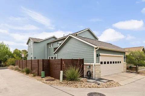 a backyard of a house with outdoor seating
