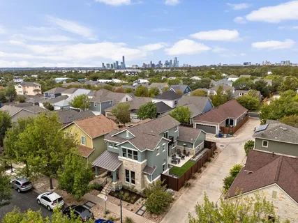 an aerial view of a house with a yard