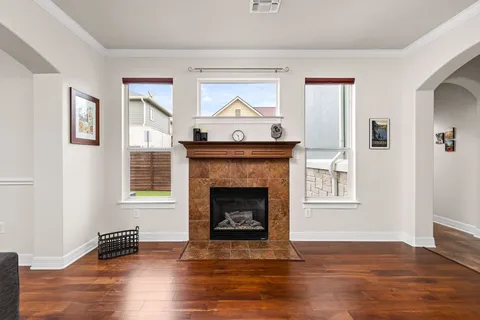 a living room with furniture and a fireplace