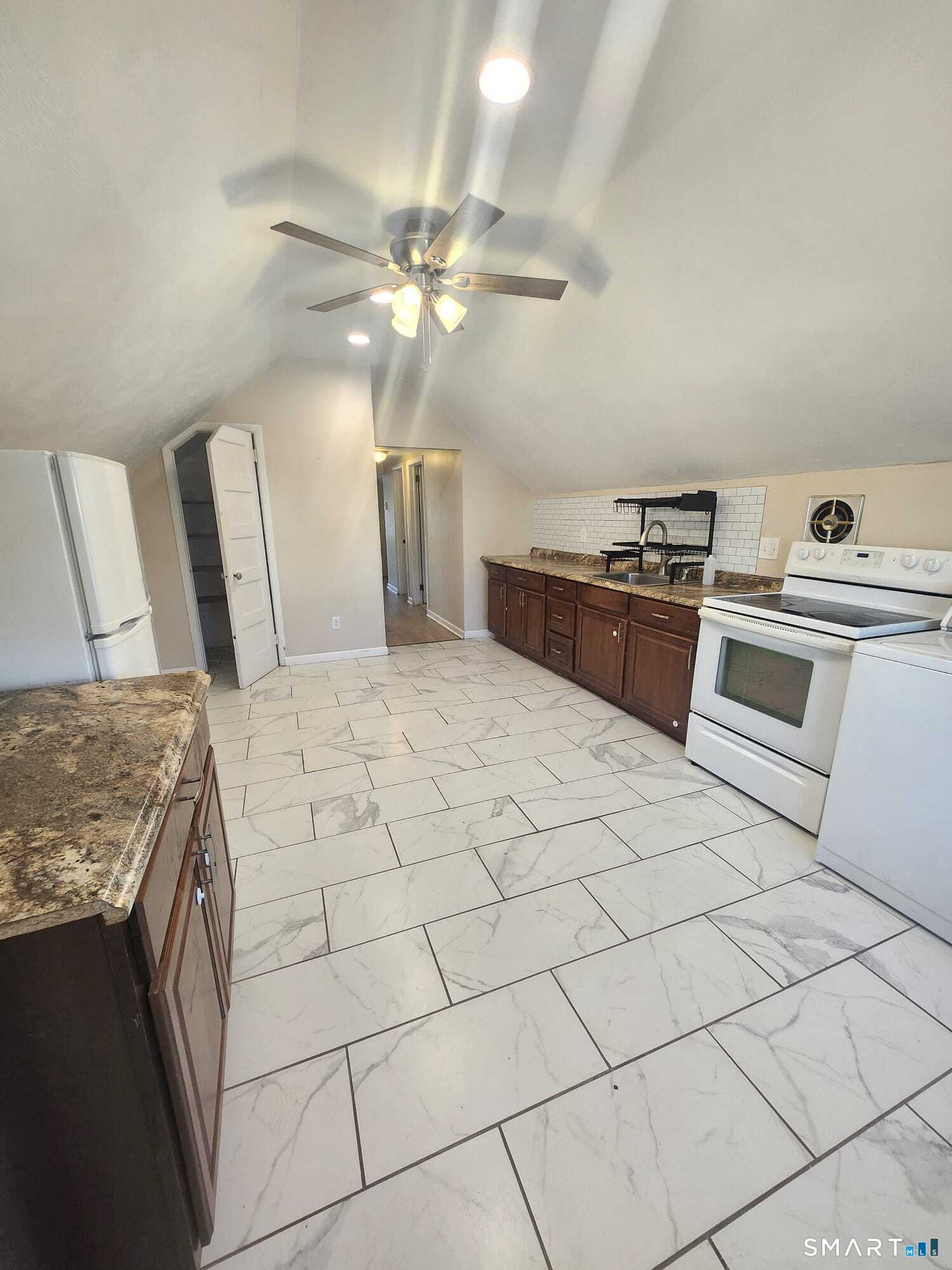 231 Winthrop Street, Unit 3 New Britain, CT 06052 - Photo 1 of 1 a kitchen with stainless steel appliances granite countertop a stove a sink and a refrigerator