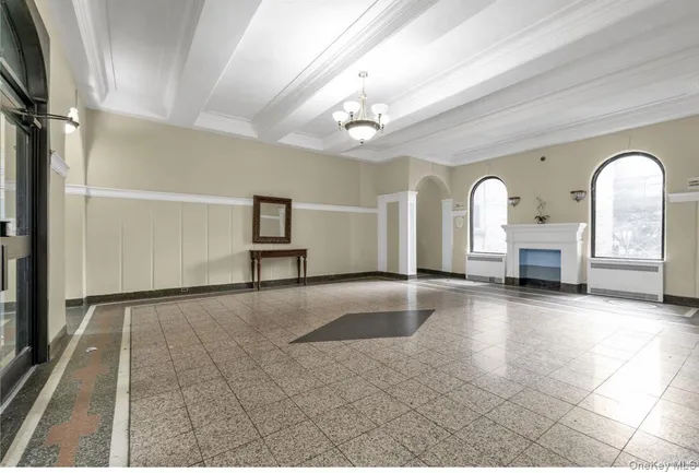 a view of empty room with a fireplace
