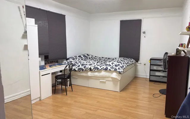 a bedroom with a bed and cabinets