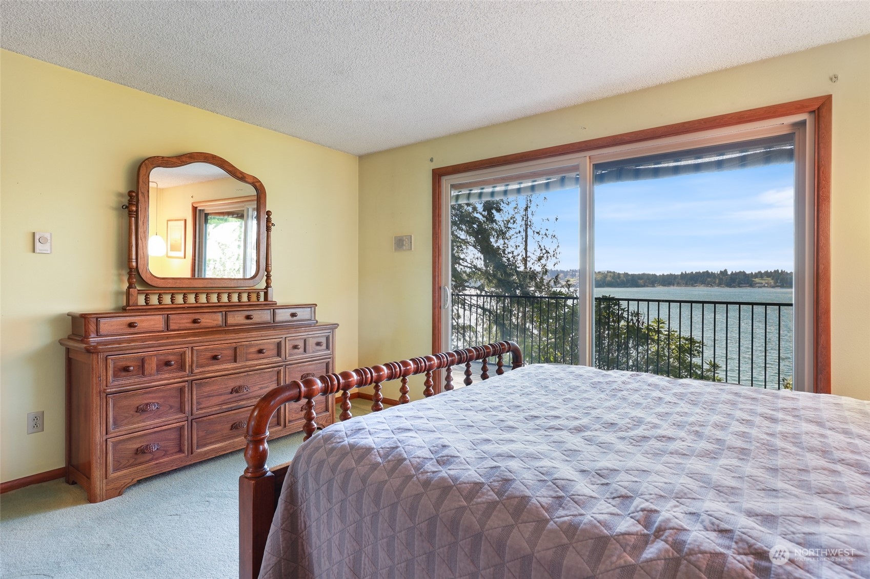 3545 Boston Harbor Road Northeast Olympia, WA 98506 - Photo 15 of 36 a bedroom with a large bed and a large window