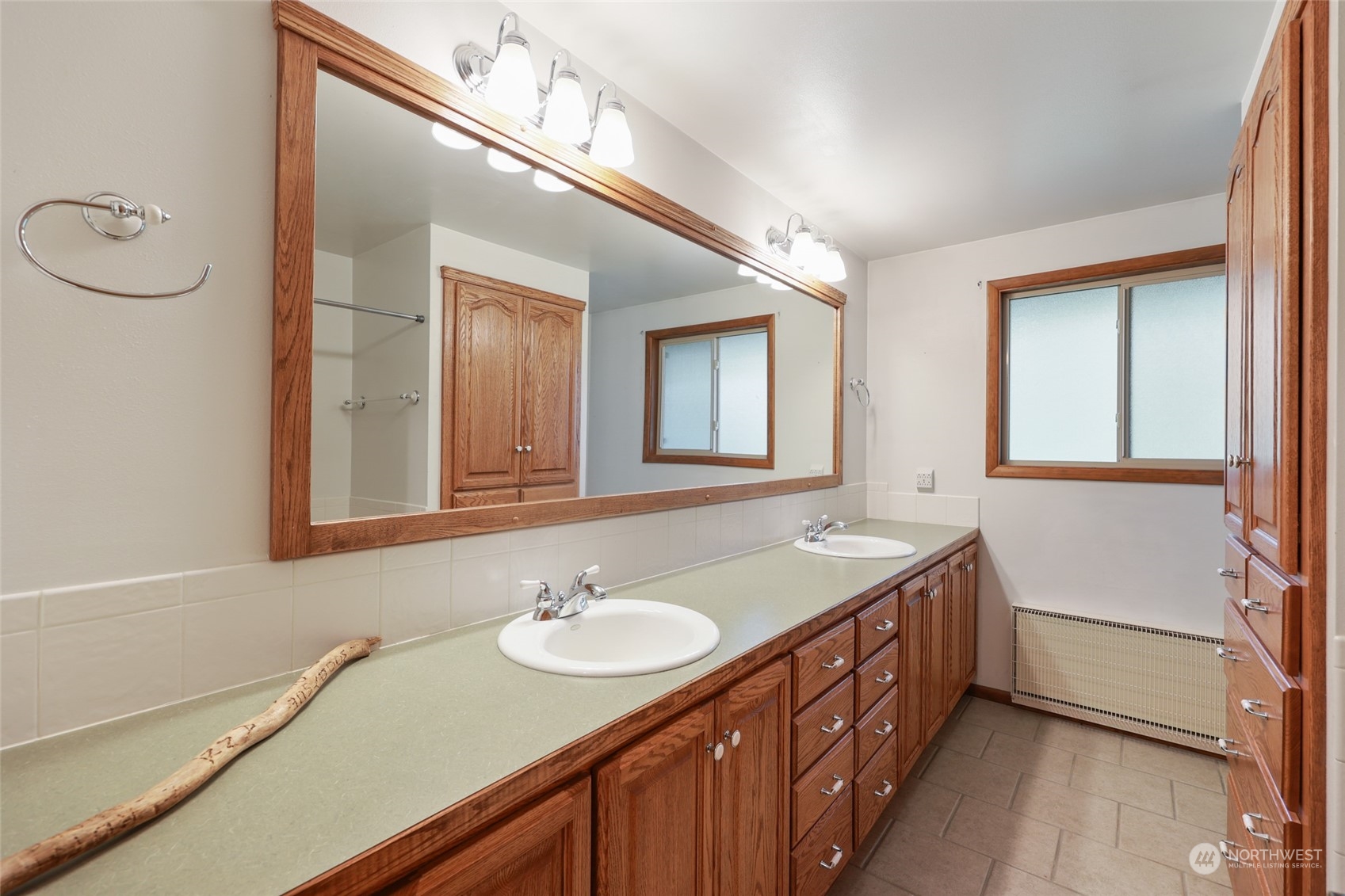 3545 Boston Harbor Road Northeast Olympia, WA 98506 - Photo 20 of 36 a bathroom with a sink and a mirror