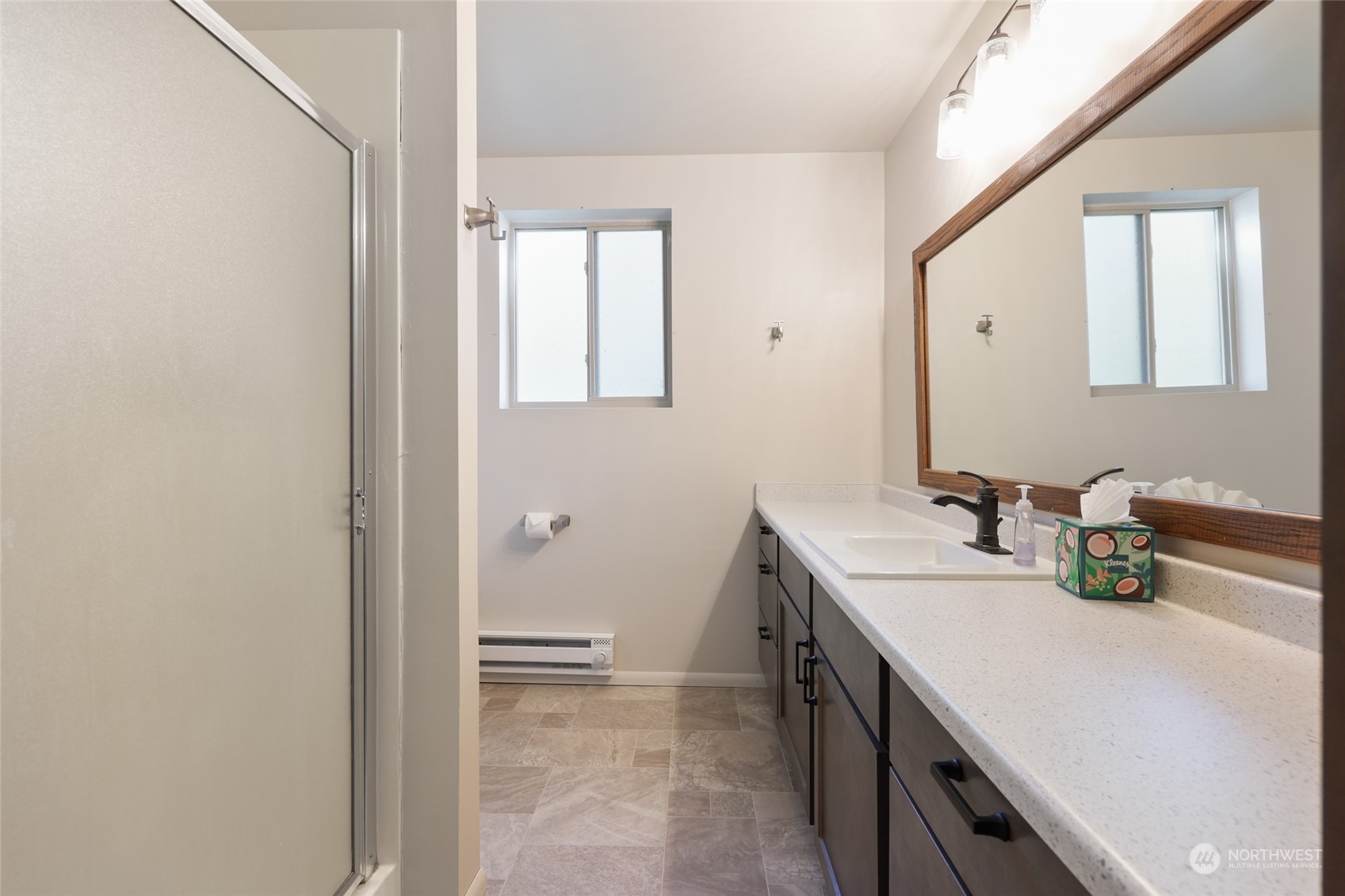 3545 Boston Harbor Road Northeast Olympia, WA 98506 - Photo 23 of 36 a bathroom with a sink vanity and a mirror