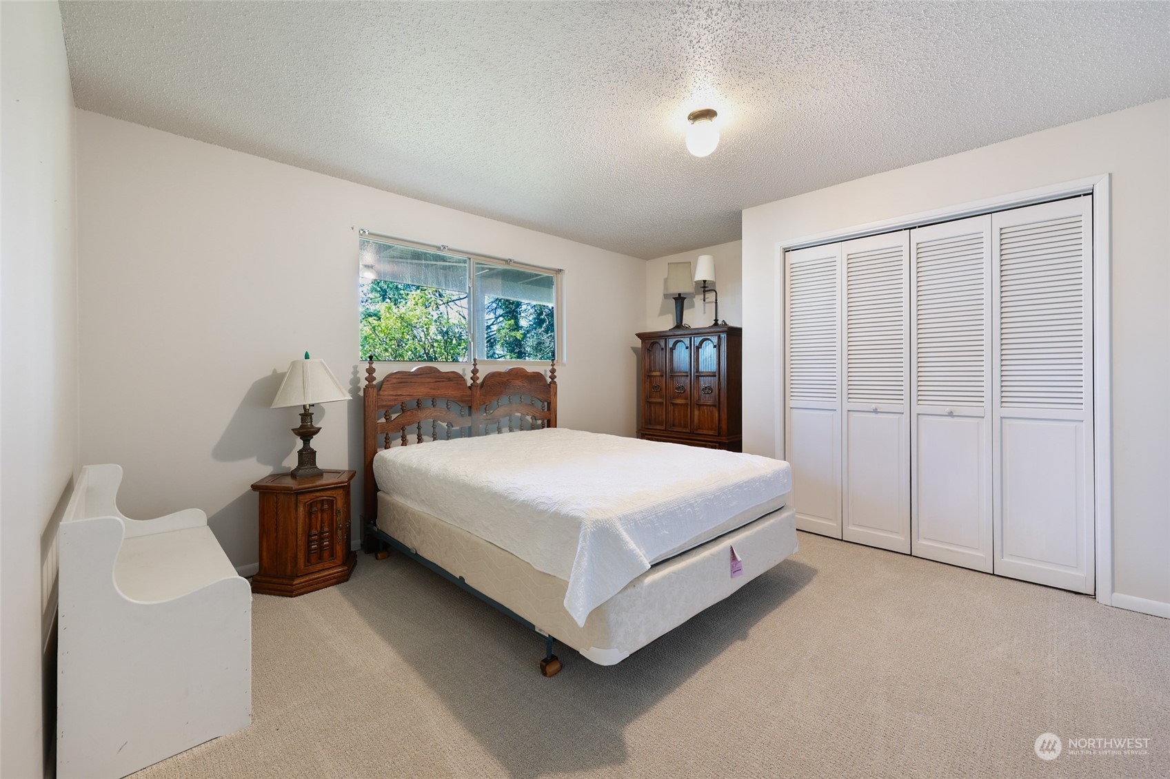 3545 Boston Harbor Road Northeast Olympia, WA 98506 - Photo 25 of 36 a bedroom with bed and window