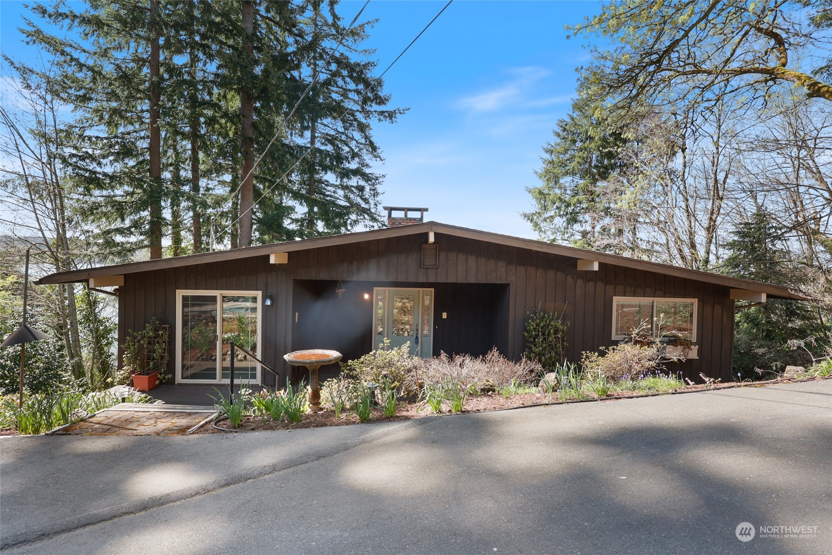 3545 Boston Harbor Road Northeast Olympia, WA 98506 - Photo 27 of 36 a front view of a house with yard and garage