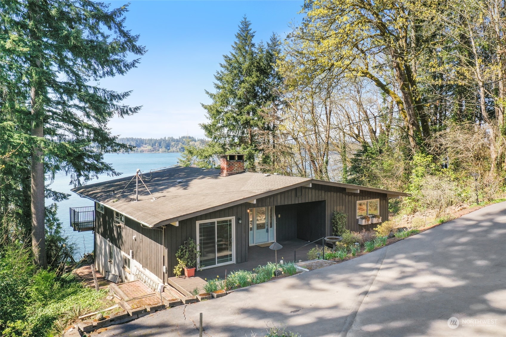 3545 Boston Harbor Road Northeast Olympia, WA 98506 - Photo 3 of 36 a view of a house with a yard and potted plants