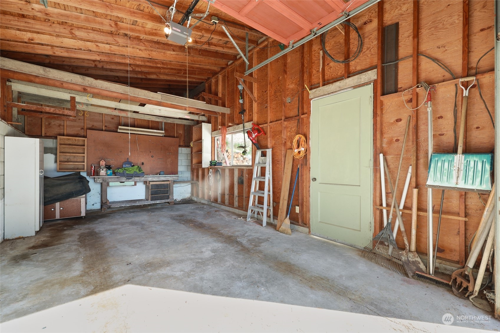 3545 Boston Harbor Road Northeast Olympia, WA 98506 - Photo 31 of 36 a view of empty room with wooden floor and windows