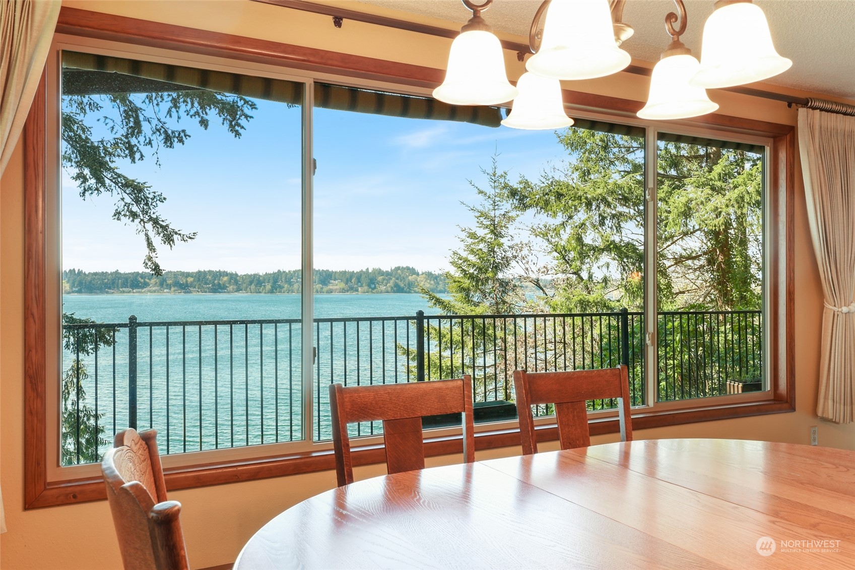 3545 Boston Harbor Road Northeast Olympia, WA 98506 - Photo 9 of 36 a balcony with table and chairs