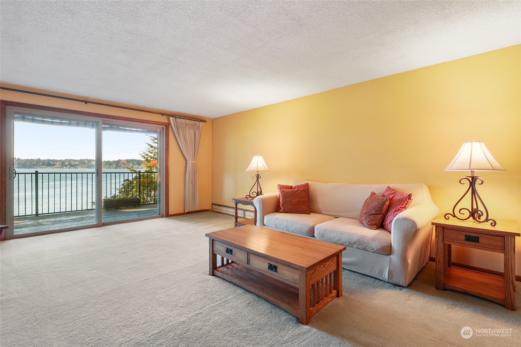 3545 Boston Harbor Road Northeast Olympia, WA 98506 - Photo 10 of 36 a living room with furniture and a large window