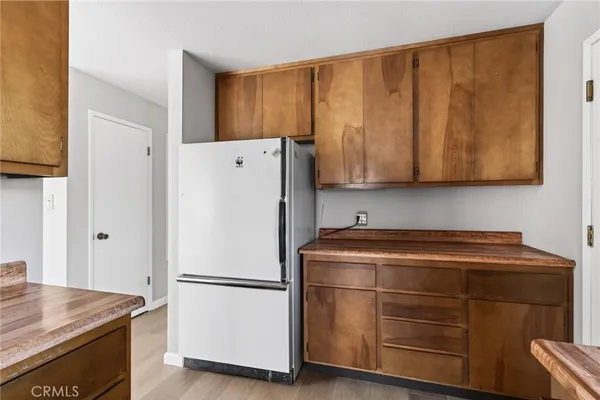 a white refrigerator freezer sitting in a kitchen