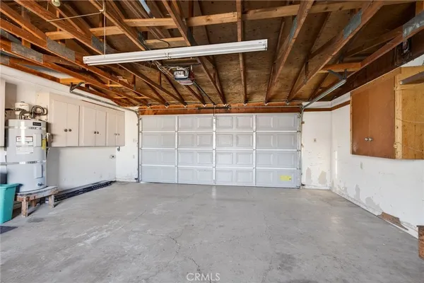 a view of an empty room with white walls