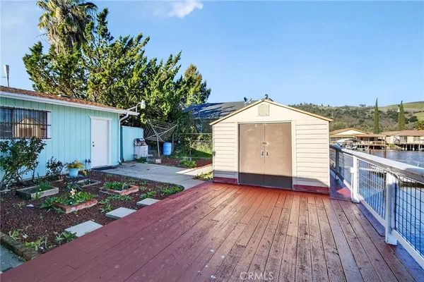 a view of a house with entertaining space and wooden floor