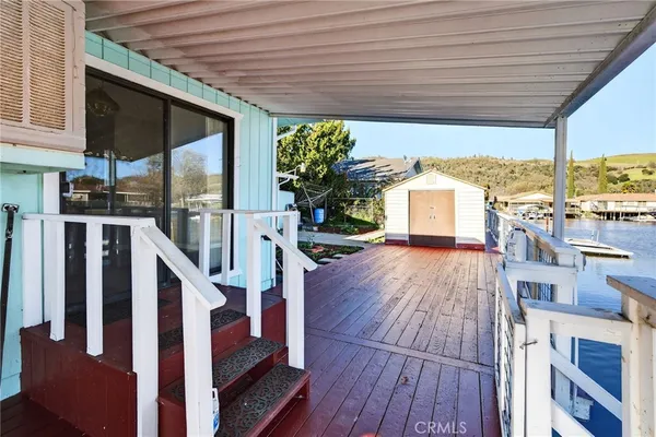 a view of a porch and wooden floor