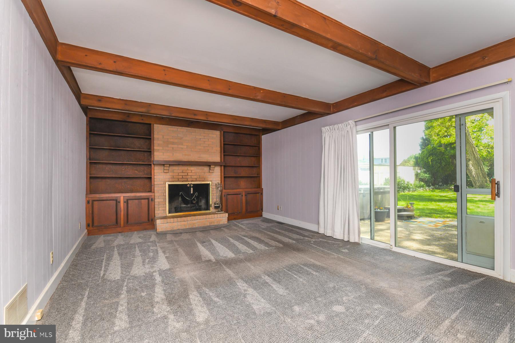48 Sunset Drive Mount Holly, NJ 08060 - Photo 20 of 46 a view of an empty room with a fireplace and a large window