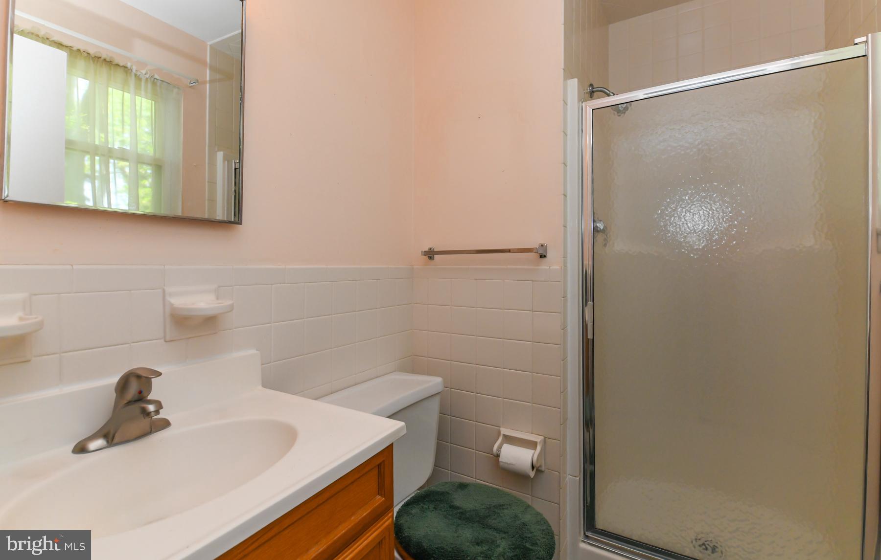 48 Sunset Drive Mount Holly, NJ 08060 - Photo 24 of 46 a bathroom with a sink a toilet and shower