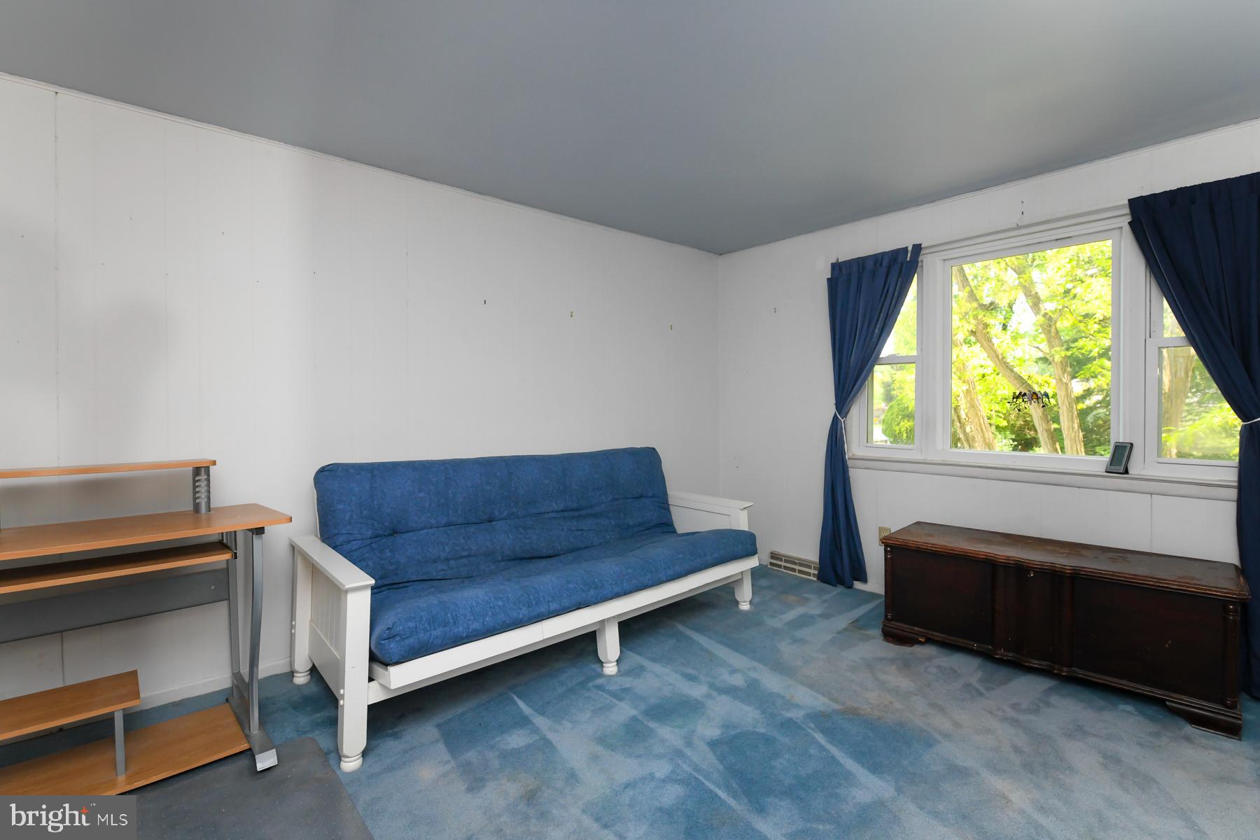 48 Sunset Drive Mount Holly, NJ 08060 - Photo 25 of 46 a living room with a bed and a window