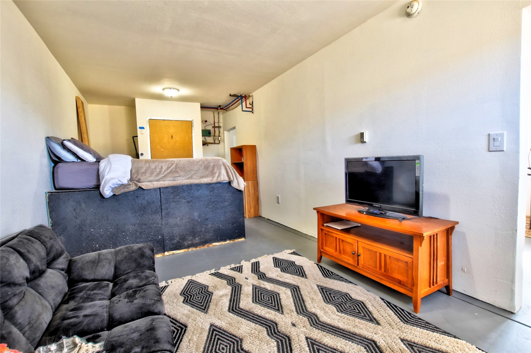 160 Rhyolite Drive Como, CO 80432 - Photo 12 of 14 a bedroom with furniture and a flat screen tv