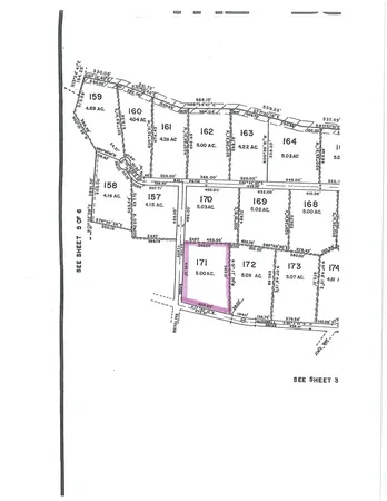 a picture of a bathroom with a glass shower