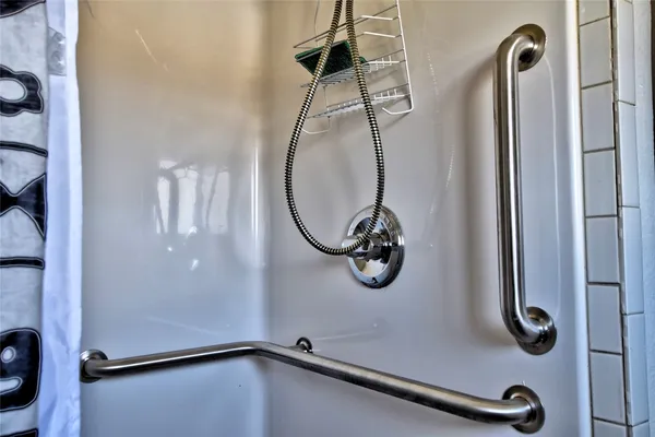 a living room with furniture and flowers
