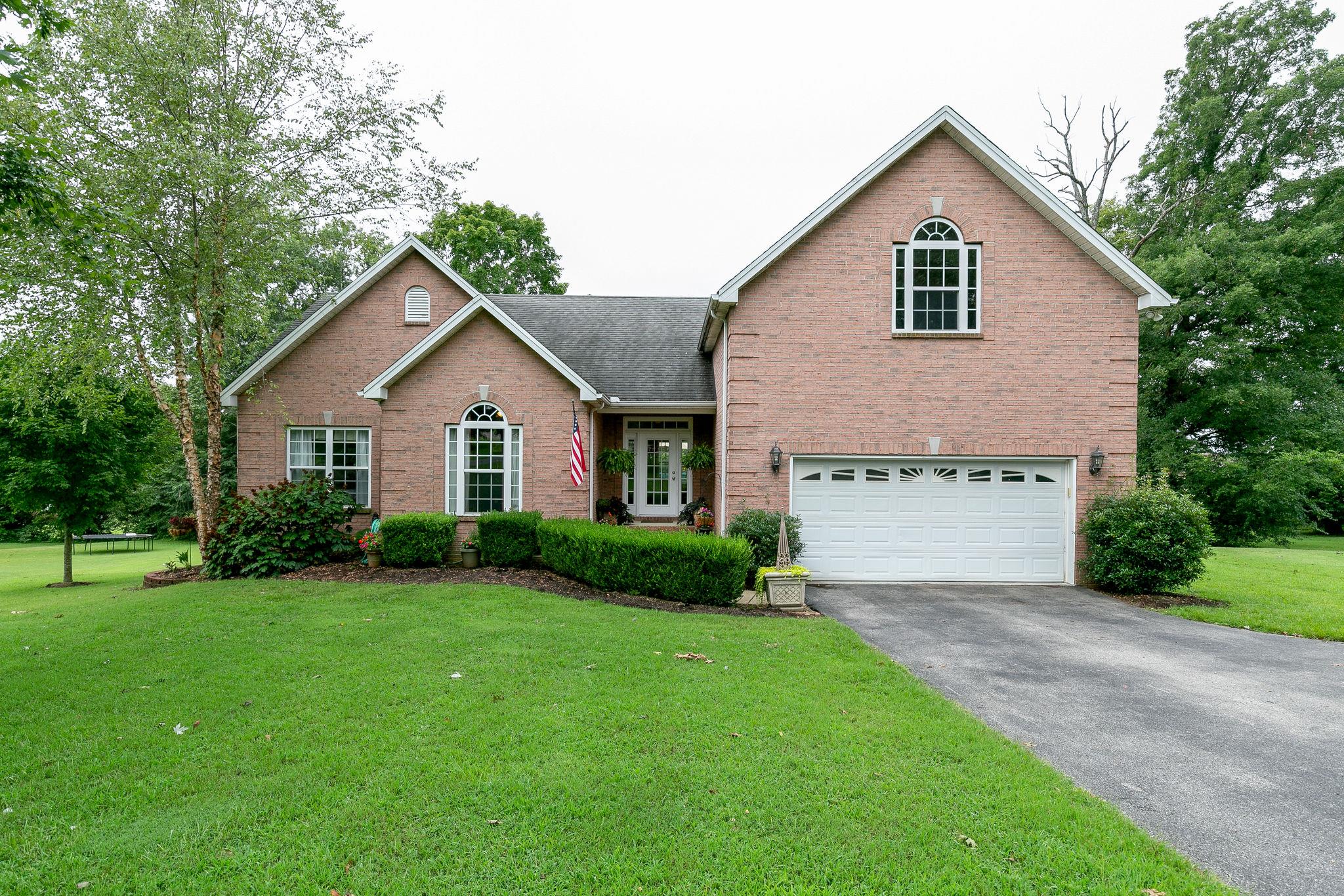 2137 Spring Lake Drive Spring Hill, TN 37174 - Photo 1 of 23 a view of a house with a yard and pathway