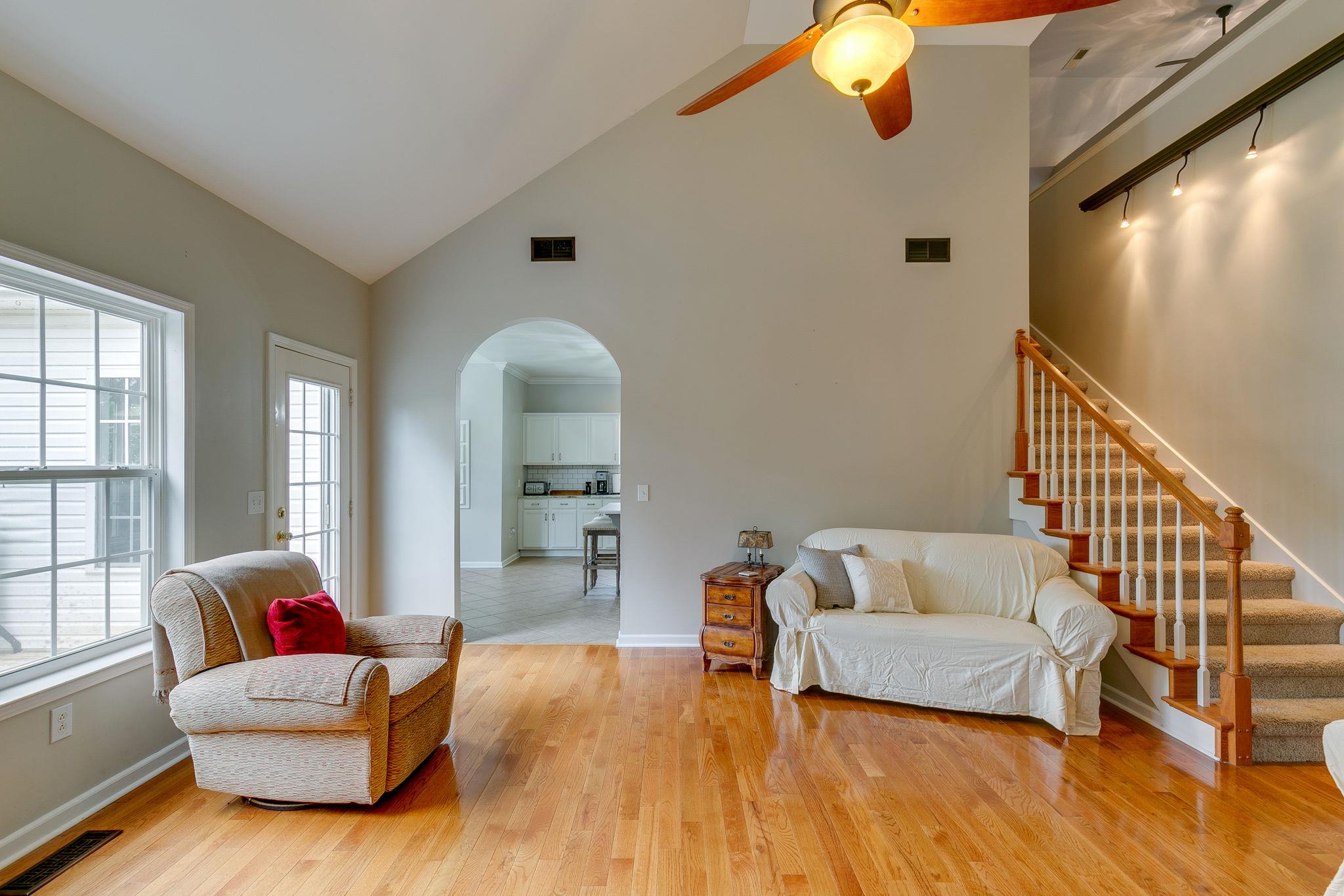 2137 Spring Lake Drive Spring Hill, TN 37174 - Photo 11 of 23 a living room with furniture and a wooden floor