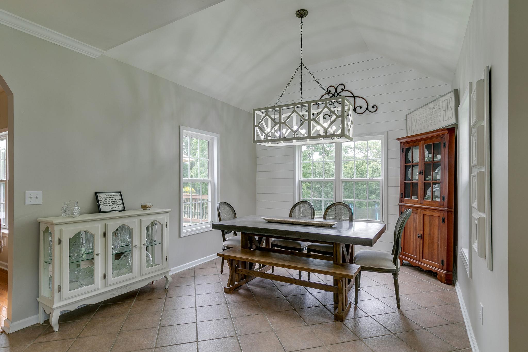 2137 Spring Lake Drive Spring Hill, TN 37174 - Photo 12 of 23 a living room with furniture a window and a chandelier