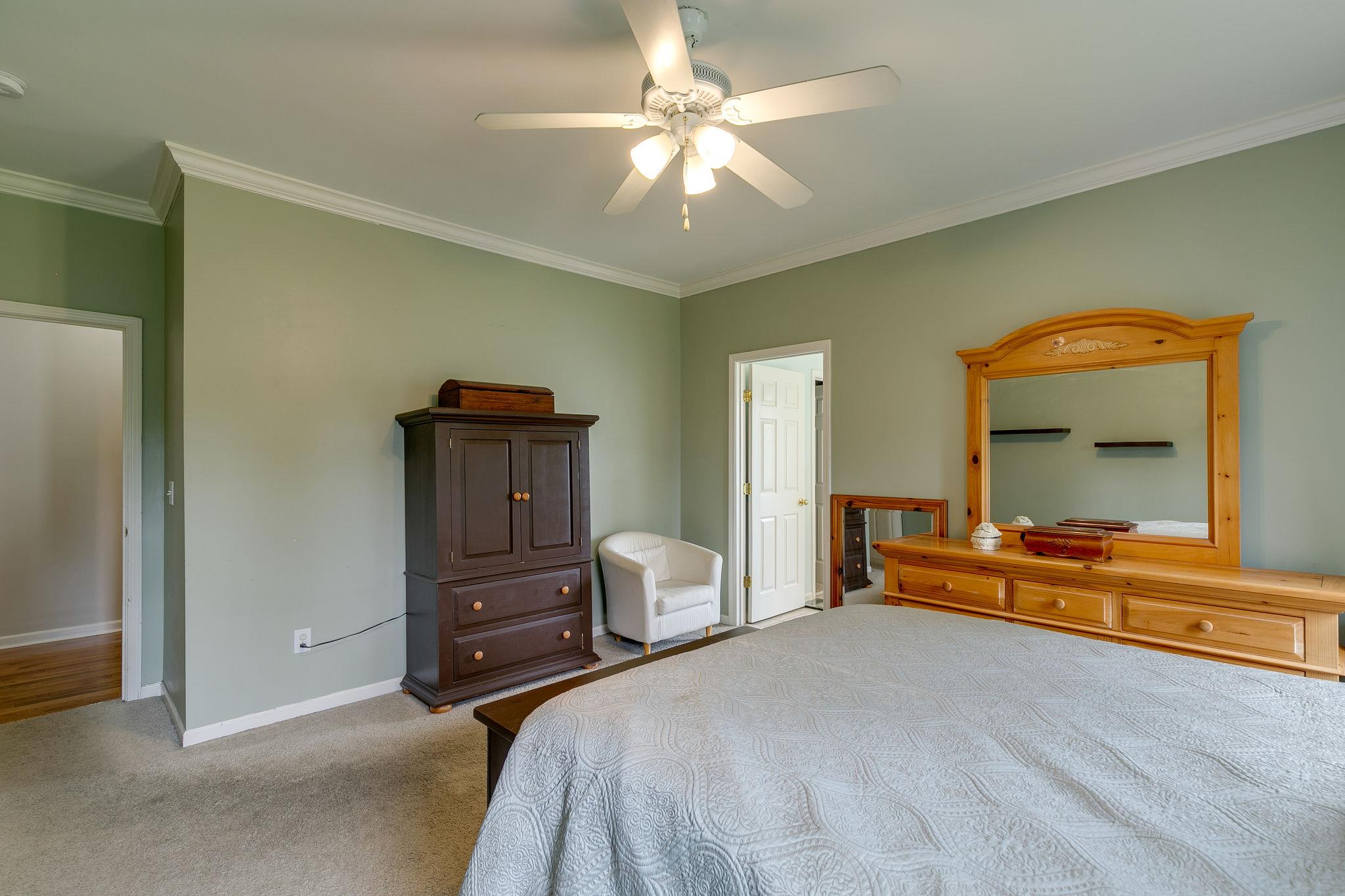2137 Spring Lake Drive Spring Hill, TN 37174 - Photo 20 of 23 a bedroom with a bed and a chandelier