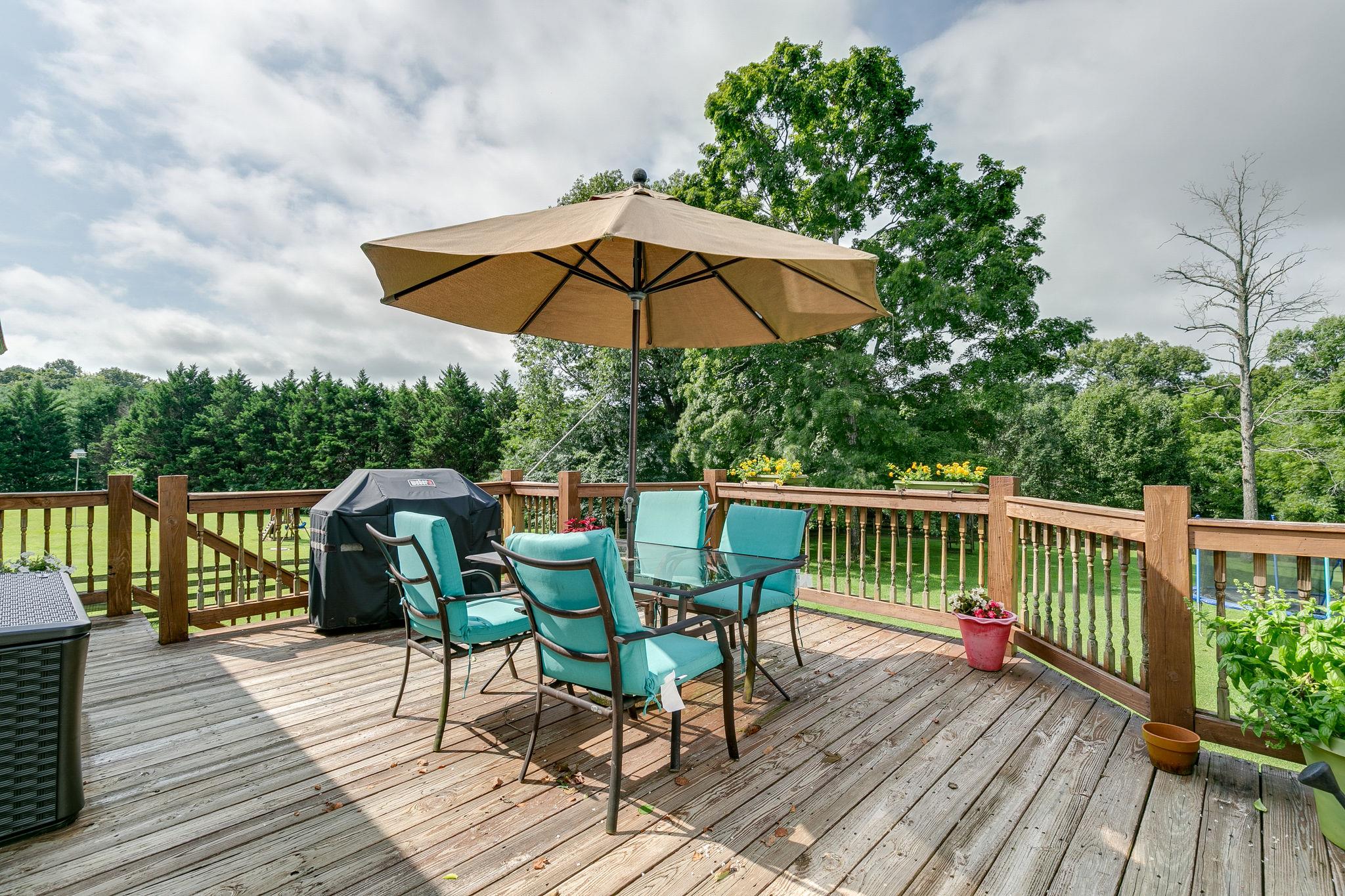 2137 Spring Lake Drive Spring Hill, TN 37174 - Photo 6 of 23 a view of balcony with outdoor seating and wooden floor