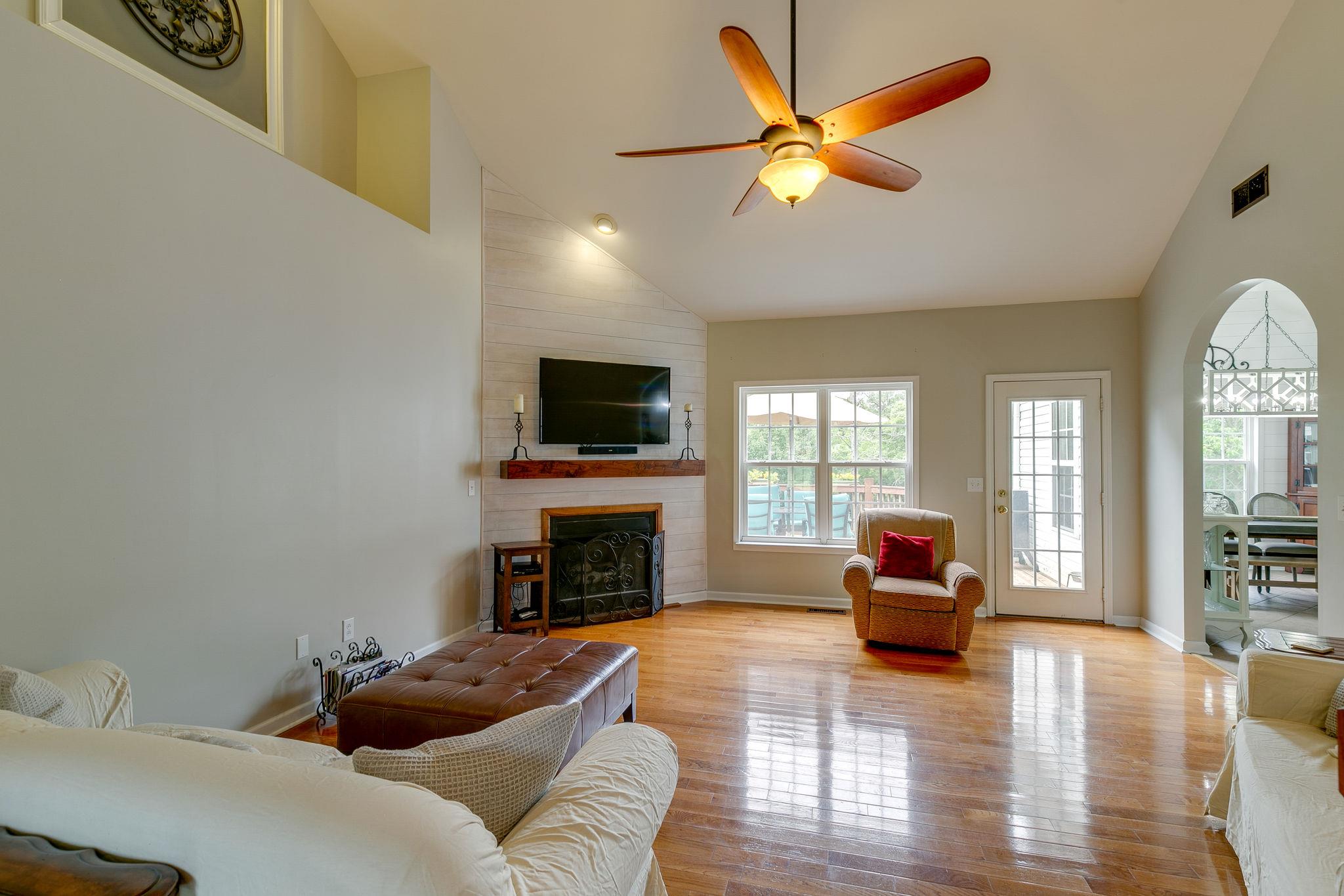 2137 Spring Lake Drive Spring Hill, TN 37174 - Photo 9 of 23 a living room with furniture and a fireplace