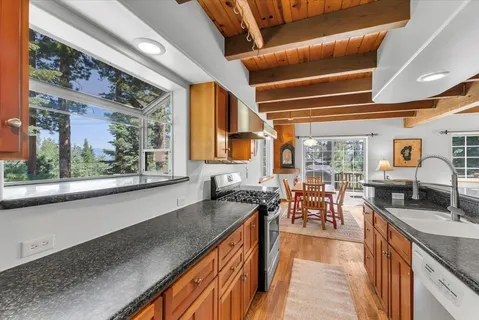 a view of a kitchen with granite countertop lots of counter top space