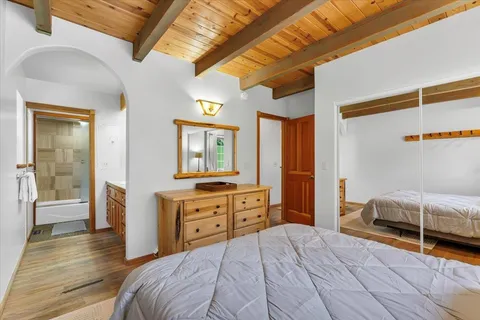 a bedroom with a bed and a dresser