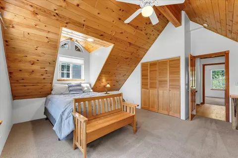 a view of a balcony with furniture and wooden floor